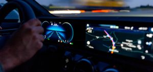 driving a car with the electronic dashboard visible